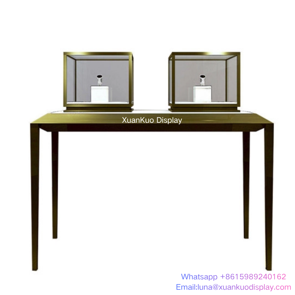 luxury LED jewelry display case, brushed brass gold metal frame, transparent tempered glass, built-in LED lighting, lockable desktop display cube, matched metal console table, ideal for ring, watch, gemstone and high-end jewellery boutique