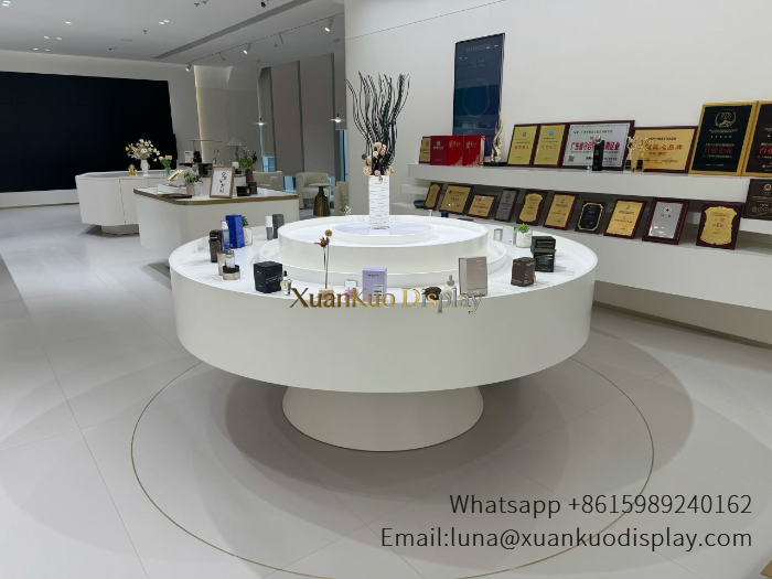 matte white two tier round perfume display island circular tiered central demo counter for fragrance beauty showroom