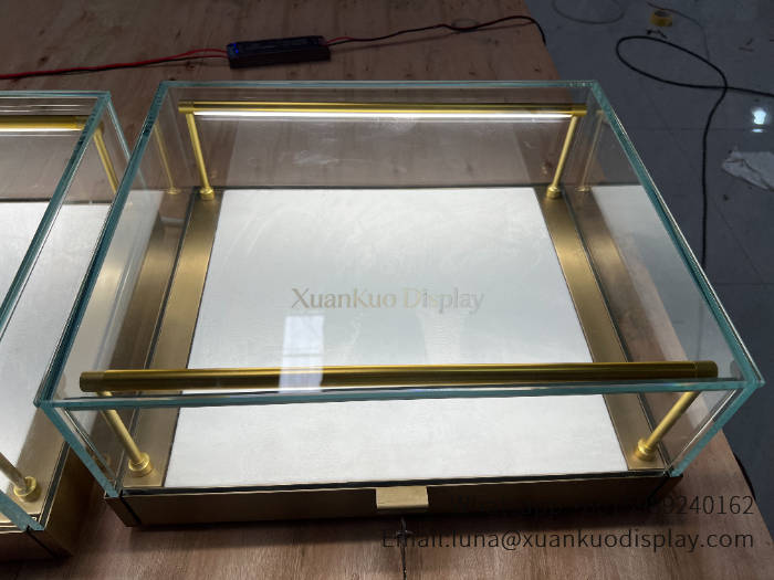 jewellery shop interior design Vietnam square tabletop jewelry display case brushed brass frame sliding glass showcase