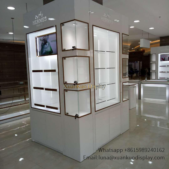 jewellery shop interior design Vietnam white gloss wood trim custom fragrance display corner glass showcase with led light brand logo